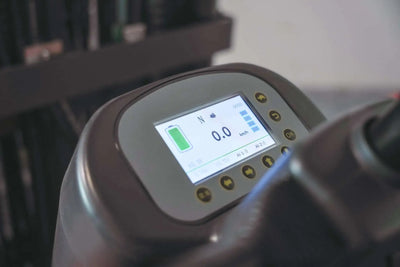 LUXX LX-7700 forklift digital dashboard display showing battery level, speed readout at 0.0 km/h, and control buttons on the instrument panel.